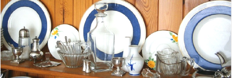 Crockery and glassware on the shelf of a Welsh Dresser